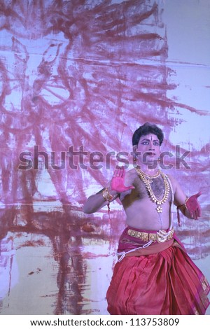HYDERABAD,AP,INDIA-MAY 27:Artist perform during International Kuchipudi dance festival at Ravindra bharati on May27,2012 in Hyderabad,Ap,India.A dance form of drawing lion and other art with feet.