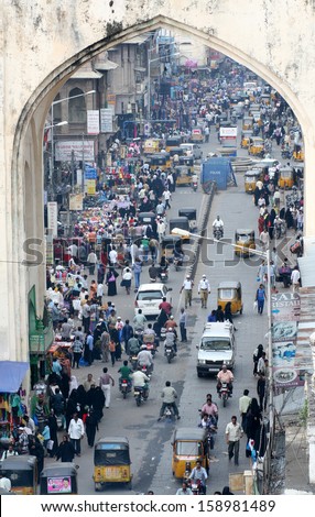 HYDERABAD,AP,INDIA-OCTOBER 10:People in the crowded road in all sorts of transport ,a typical scene as seen from the global icon of the city Charminar on october 10, 2013 in Hyderabad,Ap,India.