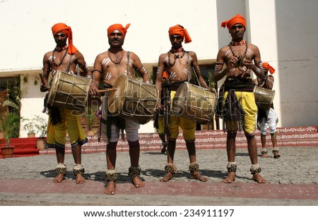 HYDERABAD,INDIA-JANUARY 13:Folk dancers dance to the rhythmic drum beats in Hyderabad,India on January 13,2014.Popular tribal dance in Andhra pradesh,India.