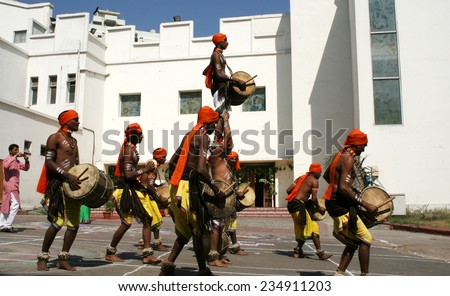 HYDERABAD,INDIA-JANUARY 13:Folk dancers dance to the rhythmic drum beats in Hyderabad,India on January 13,2014.Popular tribal dance in Andhra pradesh,India.