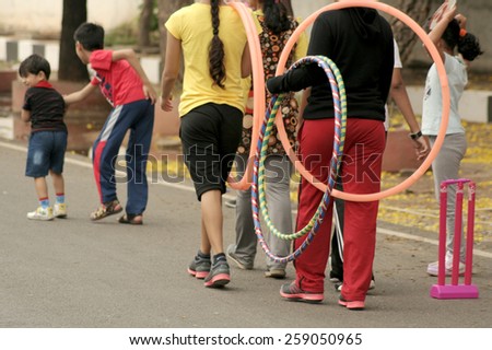 HYDERABAD,INDIA-MARCH 8:People play and involve in recreational activities during happy roads timings on March 8,2015 in Hyderabad,India.