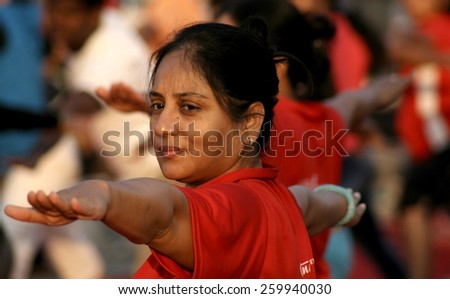 HYDERABAD,INDIA-FEBRUARY 15:People do yoga in necklace road on happy streets day (vehicular traffic stopped 6-10 AM)  on February 15,2015 in Hyderabad,India