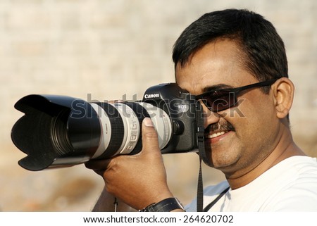 HYDERABAD,INDIA-FEBRUARY 2:Indian photographer shoot the happy streets program on February 2,2015 in Hyderabad,India.