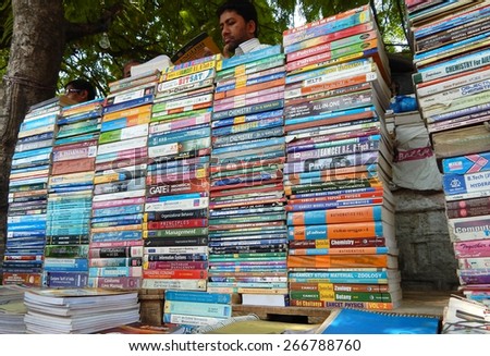 HYDERABAD,INDIA-APRIL 3:Street seller sell second hand books on various subjects on April 3,2015 in Hyderabad,India.Common scene through out the year in busy streets.
