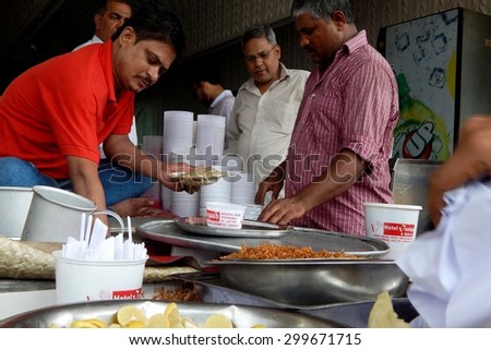 HYDERABAD,INDIA-JUlY 3:Vendor make ready Hyderabadi Haleem ,with Geographical Indication status awarded as it is popular during month of ramadan on July 3,2015 in Hyderabad,India