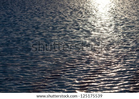 Calm surface of Red sea with sun sparkles