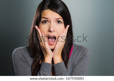 Attractive Woman Screaming In Terror With Her Hands To Her Cheeks ...