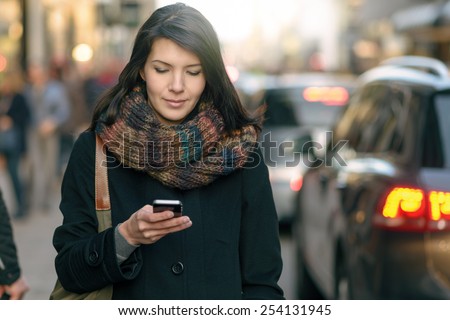 Image, Stock Photo Female traveler using her cell phone while waiting to board a plane at departure gates at asian airport terminal.