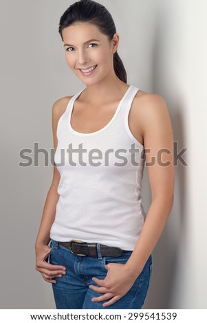 Three-quarter portrait of beautiful brunette women with a slim figure in  black bra and thong. Model snaps in the studio on white background Stock  Photo