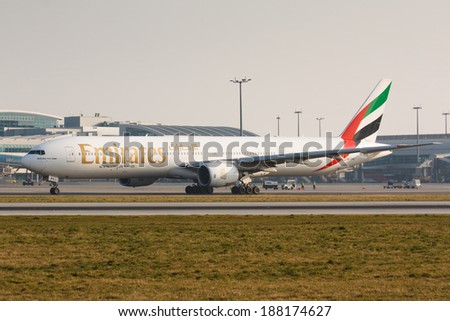 PRAGUE, CZECH REPUBLIC - MARCH 14: Boeing 777-300 Emirates taxis for take offl in PRG Airport on March 14, 2014. Emirates is an airline based in Dubai.