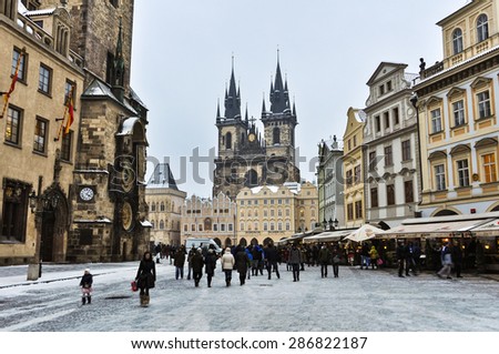 PRAGUE, CZECH REPUBLIC - 15 JANUARY 2013: Group of people in the Old Town Square in front of Tyn Church and famous Astronomical Clock.