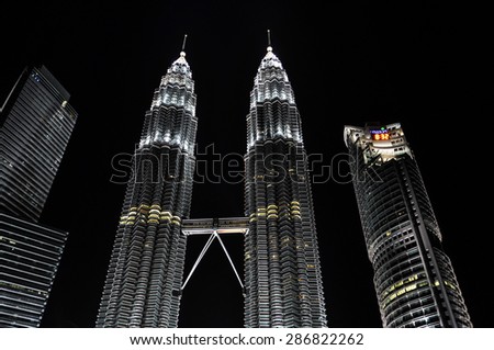 KUALA LUMPUR, MALAYSIA - 7 OCTOBER 2012: Petronas Twin Towers at night. Petronas Towers are twin skyscrapers and were tallest buildings in the world until 2004.