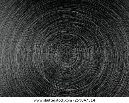 Black circular brushed steel surface background, grained metal texture