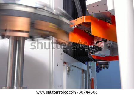 CNC machine with a mechanical arm and rotate tool changer