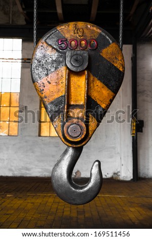 a heavy duty crane hook of an old factory