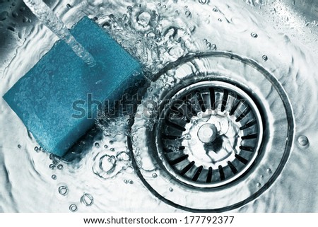 a stainless steel kitchen sink drain, detail