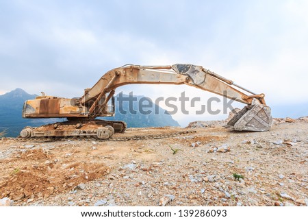 track damage excavator awaiting for repair at mining site
