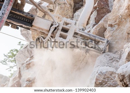 close up drilling ring drill the rock hole for demolition at mine site