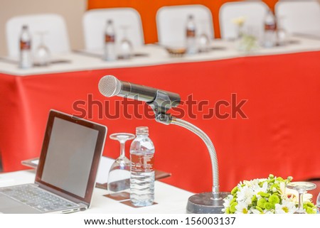 single microphone with business laptop in conference