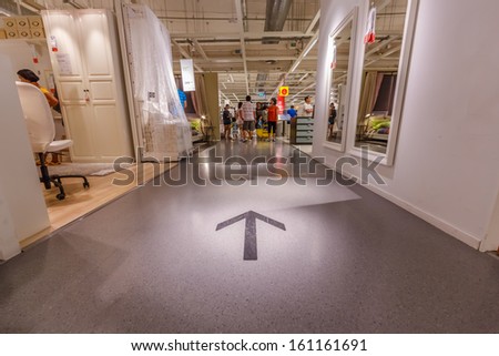 BANGKOK - OCTOBER 23: Direction sign on the floor of IKEA Bangkok Store on October 23, 2013 in Mega Bangna, Bangkok. Founded in Sweden in 1943, Ikea is the world's largest furniture retailer.