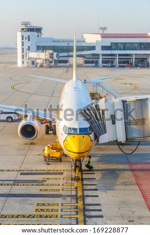 BANGKOK - DECEMBER 18: Nok Air flights  for boarding at Don Mueang International Airport on Dec 18, 13 in Bangkok. It is considered to be one of the worldÃ?Â¢??s oldest international airports.