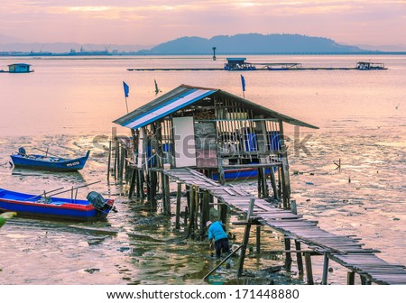 PENANG, MALAYSIA - DECEMBER 20: Fisherman house at Penag beach on Dec 20,13 in Penang, Malaysia. Penang is a state in Malaysia located on the northwest coast of Peninsular Malaysia.