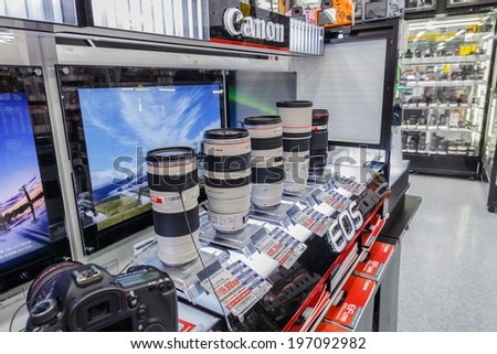 TOKYO -APRIL 11: Canon lens series display at Yodobashi electronic store on April 11, 14 in Akihabara. It is a chain store mainly selling electronic products. Currently, there are 21 stores in Japan.