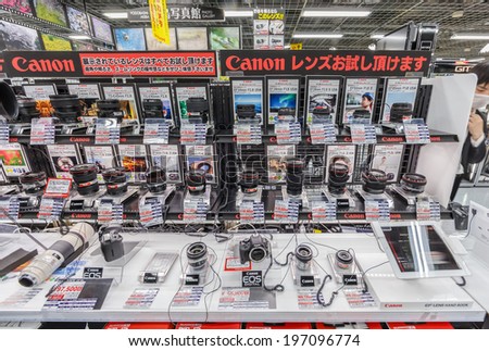 TOKYO -APRIL 11: Canon lens series display at Yodobashi electronic store on April 11, 14 in Akihabara. It is a chain store mainly selling electronic products. Currently, there are 21 stores in Japan.