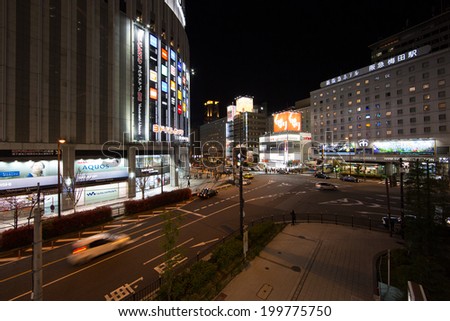 OSAKA - APR 6: Cityscape of Osaka at night on Apr 6, 14 in Osaka, Japan. It is a city in the Kansai region of Japan\'s main island of Honshu, a designated city under the Local Autonomy Law.