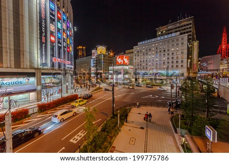 OSAKA - APR 6: Cityscape of Osaka at night on Apr 6, 14 in Osaka, Japan. It is a city in the Kansai region of Japan\'s main island of Honshu, a designated city under the Local Autonomy Law.