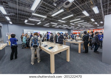 TOKYO -APRIL 11: People shop in apple booth at Yodobashi electronic store on April 11, 14 in Akihabara. It is a chain store mainly selling electronic products. Currently, there are 21 stores in Japan.