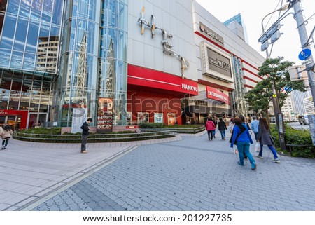 OSAKA - APRIL 7: People shop at HEP Five on April 7, 2014 in Osaka, Japan. It is a major shopping mall and entertainment center in the Umeda commercial district of Kita-ku, Osaka, Japan.
