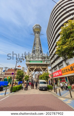 OSAKA -APRIL 7: Tsutenkaku Tower on April 7, 14 in Osaka. It is a tower and well-known landmark of Osaka, Japan and advertises Hitachi, located in the Shinsekai district of Naniwa-ku, Osaka.