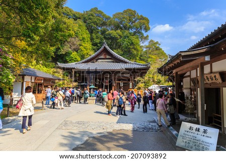 KYOTO, JAPAN - APR 8: Tourists visit Kinkaku-ji temple on Apr 8, 14 in Kyoto. It is a Zen Buddhist temple in Kyoto, Japan, the garden complex is an excellent example of Muromachi period garden design.