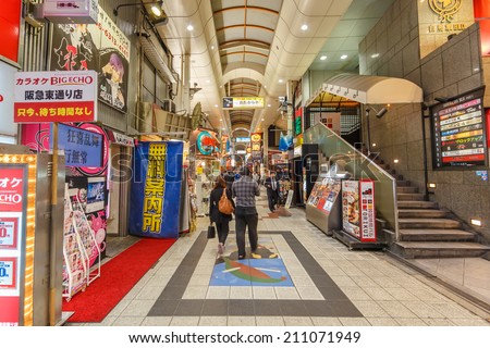OSAKA - APR 8: People shop at shopping center on Apr 8, 14 in Osaka, Japan. It is a city in the Kansai region of Japan's main island of Honshu, a designated city under the Local Autonomy Law.