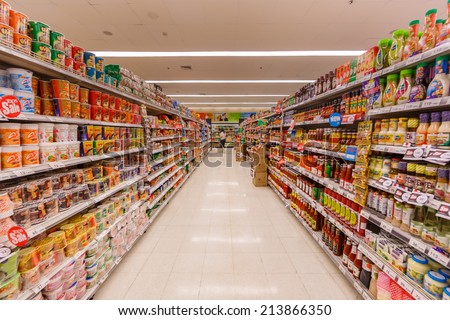 BANGKOK - JUN 22: People shop at Tops Suppermarket on Jun 22, 14 in Bangkok.It\'s a grocery chain in Thailand, the chain is operated under the name Tops Supermarket by the Central Food Retail.