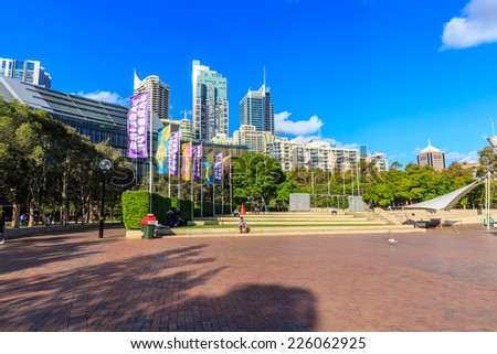 SYDNEY - MAY 12: Tumbalong Park on May 12, 2014 in Sydney. It is a park in Darling Harbour, was designed using native Australian foliage incorporated with fountains as an urban stream.