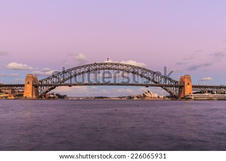 SYDNEY - MAY 11: Sydney Harbor Bridge on May 11, 2014 in Sydney. It is a steel arch bridge across Sydney Harbor that carries rail, vehicle and pedestrian traffic between the city and the North Shore.