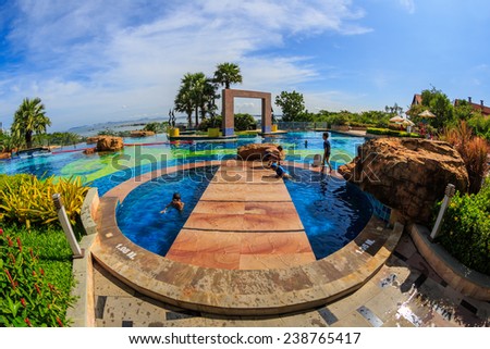 PATTAYA, THAILAND - SEP 21: Unidentified kids enjoy swimming The Zign Hotel on Sep 21, 2014 in Pattaya. It is luxury hotel in Naklua, Pattay, the interior design is back into the 1950s and 1960s.