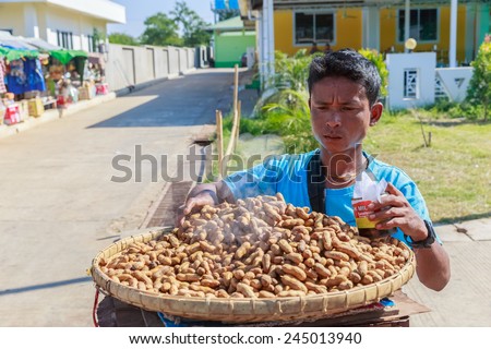 MANDALAY, MYANMAR - DEC 7: Local trader at Meiktila Rest area market on Dec 7, 2014 in Meiktila. Meiktila is a city in central Myanmar, located on the banks of Lake Meiktila in Mandalay Division.
