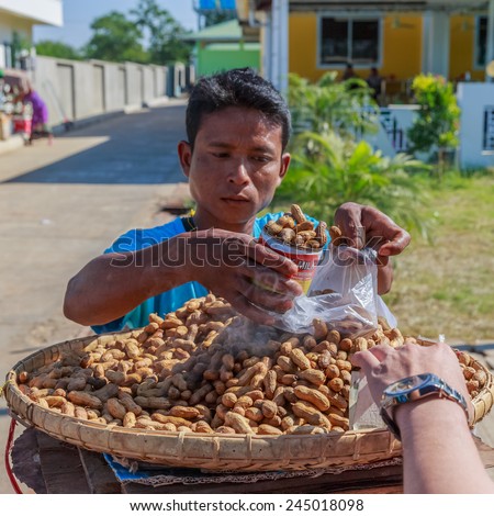 MANDALAY, MYANMAR - DEC 7: Local trader at Meiktila Rest area market on Dec 7, 2014 in Meiktila. Meiktila is a city in central Myanmar, located on the banks of Lake Meiktila in Mandalay Division.