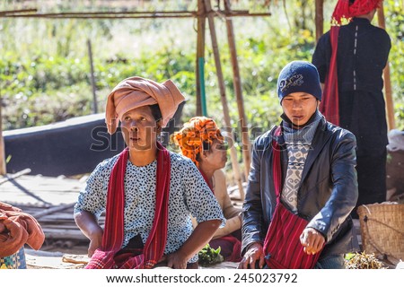 INLE LAKE, MYANMAR - DEC 8: Local traders at 5 Day market on Dec 8, 2014 in Inle. Hand-made goods and food for local use and trading are another source of commerce in Inle.