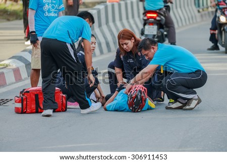 BANGKOK -AUG 16 : Rescuse team assist cyclist at Bike for mom event on Aug 16, 2015. The event is to cerebrate 83rd Her Majesty Queen Sirikit Birth Day which takes places all over the country.