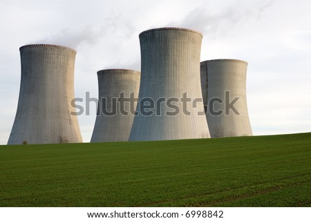A view of four massive cement cooling towers in an open field at the nuclear power station at Dukovany, Czechoslovakia.