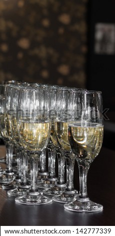glasses of champagne waiting to be served by guests in a restaurant, new year\'s eve.