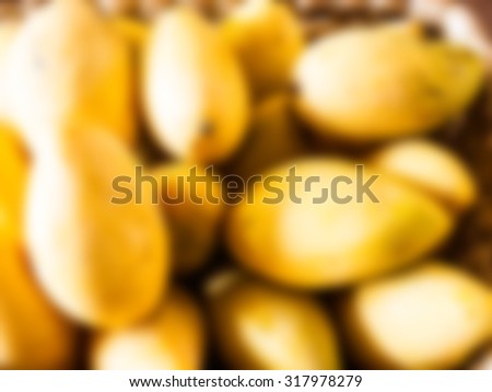 Yellow ripe mangoes from Thailand blurred background for tropical fruit concept