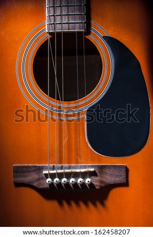 top view of a guitar with broken string