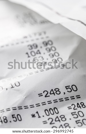 crumpled sales receipt close up on the table