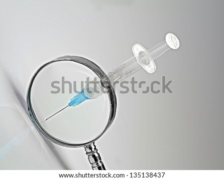 pay attention  the needle of a syringe  is pointed, white background