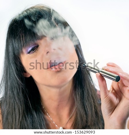 brunette beautiful girl smoking electronic cigarette
